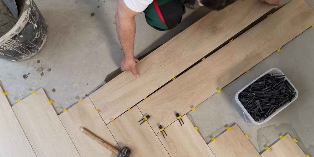 top-view-man-tiling-floor